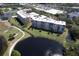 Aerial view of condo building complex near water at 4550 Pinebrook Cir # 103, Bradenton, FL 34209