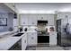 Modern kitchen with white cabinets, stainless steel appliances, and stone backsplash at 4550 Pinebrook Cir # 103, Bradenton, FL 34209