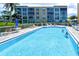 Relaxing community pool with ample lounge space at 4550 Pinebrook Cir # 103, Bradenton, FL 34209