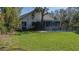 White house with screened porch and a fenced-in pool at 908 Pomelo Ave, Sarasota, FL 34236