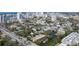 Aerial view of Sarasota neighborhood near the water, showcasing homes and city skyline at 908 Pomelo Ave, Sarasota, FL 34236