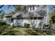 White house exterior with large trees and grassy yard at 908 Pomelo Ave, Sarasota, FL 34236