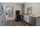 Small kitchen with vintage stove, refrigerator, and tiled floor at 908 Pomelo Ave, Sarasota, FL 34236