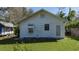 White house exterior with AC unit and small yard at 908 Pomelo Ave, Sarasota, FL 34236