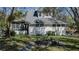 White house exterior with a stone well and grassy yard at 908 Pomelo Ave, Sarasota, FL 34236
