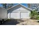 White two-car garage with ample parking space at 908 Pomelo Ave, Sarasota, FL 34236