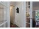 Vintage hallway with an antique telephone and access to other rooms at 908 Pomelo Ave, Sarasota, FL 34236