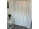 White closet with bi-fold doors and side table at 6006 Hibiscus Dr # 6006, Bradenton, FL 34207