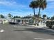 Community clubhouse with parking lot and golf cart at 6006 Hibiscus Dr # 6006, Bradenton, FL 34207