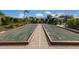 Two bocce ball courts with brick borders at 8720 Bellussi Dr, Sarasota, FL 34238