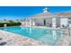 Community pool with seating and adjacent cabana at 251 Okeeffe Cir, Bradenton, FL 34212