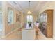 Elegant dining room features a rustic wood table, chandelier, and built-in hutch at 5606 Mulligan Way, Lakewood Ranch, FL 34211