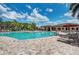 Inviting pool area with ample lounge chairs at 115 Winding River Trl, Bradenton, FL 34212