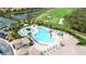 Resort-style pool with lounge chairs and umbrellas at 115 Winding River Trl, Bradenton, FL 34212
