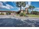Community clubhouse with landscaping and golf carts at 115 Winding River Trl, Bradenton, FL 34212