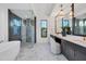 Luxurious bathroom with a soaking tub, walk-in shower, and dual vanities at 1209 Blue Shell Loop, Sarasota, FL 34240