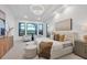 Spacious main bedroom with plush bed and sitting area at 1209 Blue Shell Loop, Sarasota, FL 34240