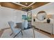 Bright home office with a modern desk and geometric cabinet at 1209 Blue Shell Loop, Sarasota, FL 34240