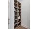 Well-designed pantry with ample shelving for storage at 1209 Blue Shell Loop, Sarasota, FL 34240