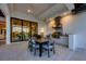 Outdoor kitchen with stainless steel appliances and dining area at 1209 Blue Shell Loop, Sarasota, FL 34240