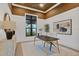 Stylish home office with a large desk and window views at 1209 Blue Shell Loop, Sarasota, FL 34240