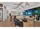 Open living space with sectional sofa, high ceilings, and kitchen views at 1209 Blue Shell Loop, Sarasota, FL 34240