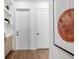 Bright hallway with modern doors and art at 1209 Blue Shell Loop, Sarasota, FL 34240