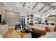 Living area featuring a sectional sofa and neutral color palette at 1209 Blue Shell Loop, Sarasota, FL 34240