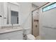 Modern bathroom with a walk-in shower and vanity at 1209 Blue Shell Loop, Sarasota, FL 34240