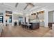 Modern kitchen with island, stainless steel appliances, and hardwood floors at 1209 Blue Shell Loop, Sarasota, FL 34240