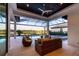 Relaxing covered patio overlooking the pool and lake at 1209 Blue Shell Loop, Sarasota, FL 34240
