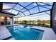 Enjoy this relaxing pool area with a screened enclosure at 1209 Blue Shell Loop, Sarasota, FL 34240