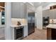 Sleek kitchen with stainless steel appliances and wine cooler at 1209 Blue Shell Loop, Sarasota, FL 34240