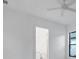 Bright bedroom with ensuite bathroom access and ceiling fan at 1209 Blue Shell Loop, Sarasota, FL 34240