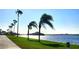 Scenic waterfront walkway with palm trees at 10315 Cortez W Rd # 28F, Bradenton, FL 34210