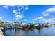 Community boat docks with many boats on sunny day at 12 Brentwood Ln, Englewood, FL 34223