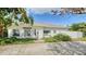 White house exterior with landscaping and a paved driveway at 1789 Loma Linda St, Sarasota, FL 34239