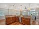 Modern kitchen with granite island, stainless steel appliances, and hardwood floors at 1789 Loma Linda St, Sarasota, FL 34239