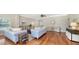 Spacious living room with hardwood floors and light blue sofas at 1789 Loma Linda St, Sarasota, FL 34239