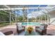 Screened-in pool and patio furniture for outdoor enjoyment at 1789 Loma Linda St, Sarasota, FL 34239