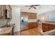 Well-lit kitchen featuring stainless steel appliances, granite countertops, and hardwood flooring at 1789 Loma Linda St, Sarasota, FL 34239