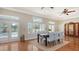 Dining room with hardwood floors, a table for six, and access to the pool at 1789 Loma Linda St, Sarasota, FL 34239