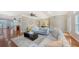 Open living room with hardwood floors and access to the kitchen at 1789 Loma Linda St, Sarasota, FL 34239
