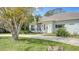 House exterior showcasing a walkway and mature trees at 1789 Loma Linda St, Sarasota, FL 34239