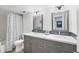 Bathroom with double vanity and updated fixtures at 2100 Benjamin Franklin Dr # 205, Sarasota, FL 34236