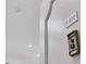 Building entry with intercom and unit number indicator at 2100 Benjamin Franklin Dr # 205, Sarasota, FL 34236