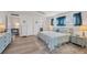 Main bedroom with ensuite access and large dresser at 2100 Benjamin Franklin Dr # 205, Sarasota, FL 34236