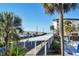 Covered parking area with palm trees and ocean view at 2100 Benjamin Franklin Dr # 205, Sarasota, FL 34236