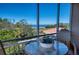 Relaxing screened balcony with a table and chairs to enjoy the outdoors at 2715 Terra Ceia Bay Blvd # 201, Palmetto, FL 34221
