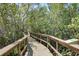 Nature trail boardwalk through mangroves with informative signage at 2715 Terra Ceia Bay Blvd # 201, Palmetto, FL 34221